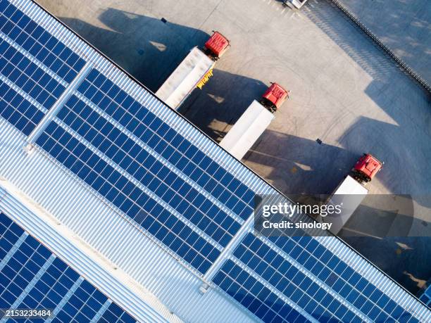 truck loading in warehouse,solar panels on factory rooftop - componente elétrico imagens e fotografias de stock