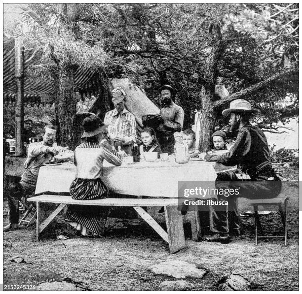 antique image: eating outdoors, rocky mountains - group dining outside stock illustrations