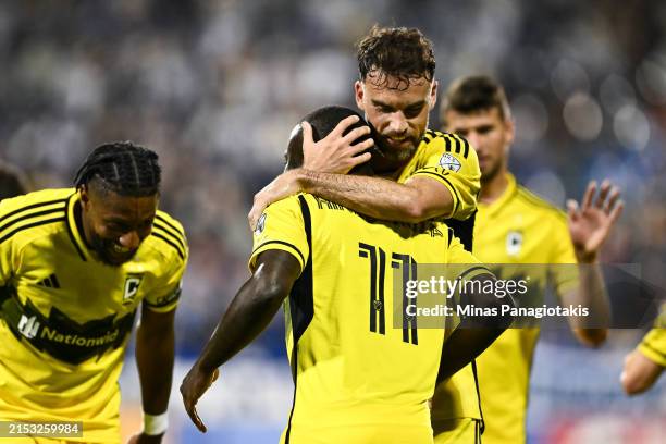 Marino Hinestroza of Columbus Crew receives a hug from teammate Rudy Camacho after scoring during the second half against CF Montréal at Saputo...