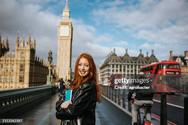 happy beautiful female student in london - campus tour stock pictures, royalty-free photos & images