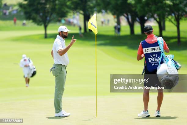 Scottie Scheffler of the United States reacts after an eagle on the first green during the first round of the 2024 PGA Championship at Valhalla Golf...