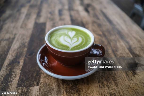 matcha latte on the table - latte stock pictures, royalty-free photos & images