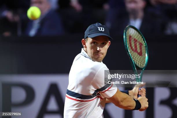 Nicolas Jarry of Chile plays a backhand against Stefanos Tsitsipas of Greece during their Men's Singles Quarter Final match on Day Eleven of the...