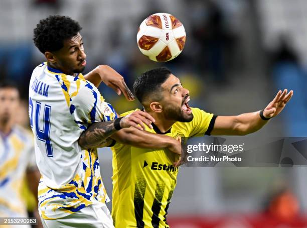 Bruno Ramos of Qatar SC and Homam Elamin Ahmed of Al-Gharafa SC are battling for the ball during the Amir Cup Semi-final match between Qatar SC and...