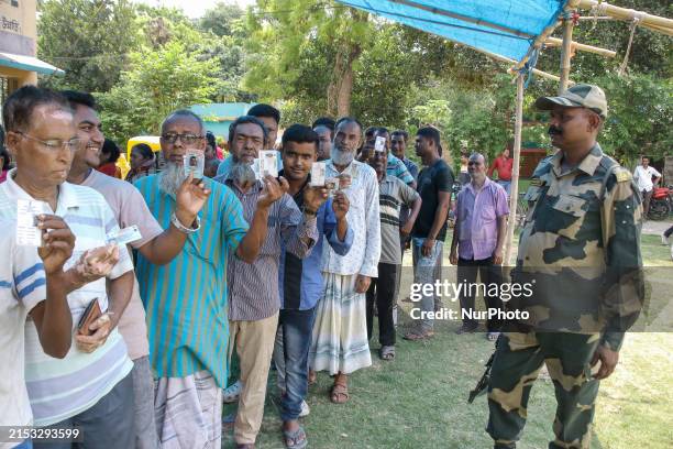 Voters are queuing outside a polling station in Bongaon district, 100 kilometers from Kolkata, India, on May 20 during the 5th phase of Lok Sabha...
