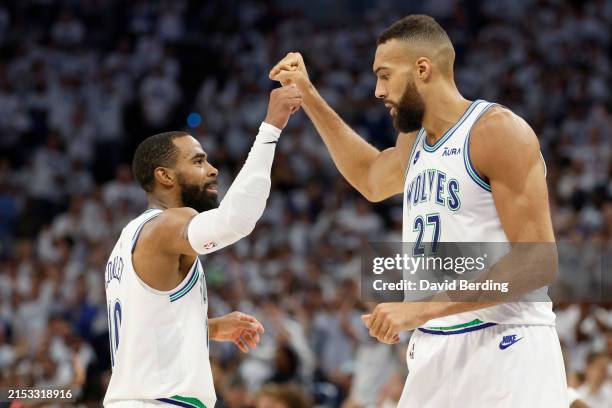 Rudy Gobert of the Minnesota Timberwolves celebrates with Mike Conley against the Denver Nuggets during the fourth quarter in Game Six of the Western...