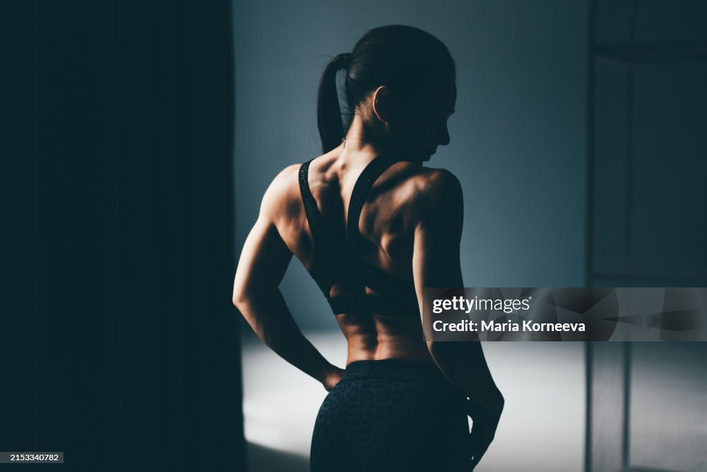 Portrait of beautiful fit woman in gym.