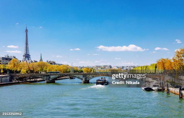 scenic view of eiffel tower and seine river in paris - seine river stock pictures, royalty-free photos & images