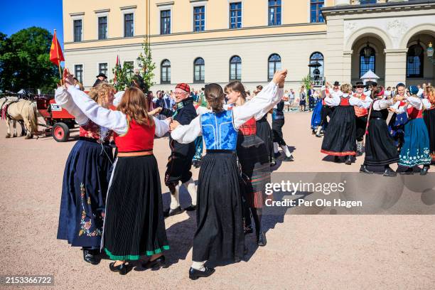 Folk dancers dancfe in front of the Royal Castle during the Norwegian National Day on May 17, 2024 in Oslo, Norway.