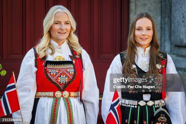 Crown Princess Mette Marit L) and Princess Ingrid Alexandra greet the children's parade at their residence Skaugum in Asker, during the Norwegian...
