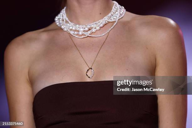 Model, jewellery detail, walks the runway during the Pandora's Closing Night show during Australian Fashion Week Presented By Pandora 2024 at...