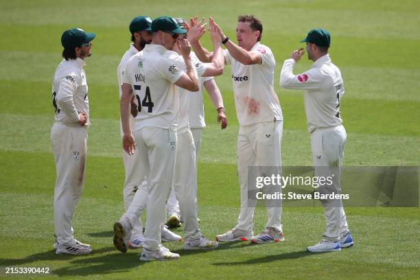 Nathan Smith of Worcestershire celebrates taking the wicket of Ollie Pope of Surrey caught by Gareth Roderick during Day 1 of the Vitality County...