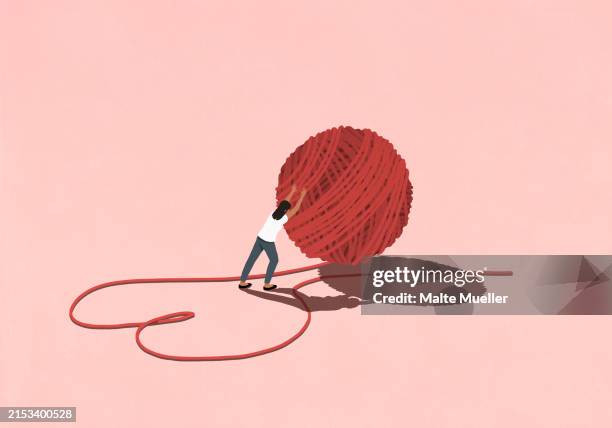 illustrations, cliparts, dessins animés et icônes de woman pushing large ball of red string forming heart-shape on pink background - red string with heart shape