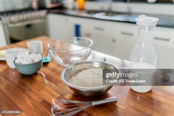 wheat flour and milk on top of the kitchen island - mixing bowl stock pictures, royalty-free photos & images