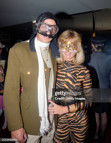 England player David Gower dressed as a pilot and friend in tiger suit fancy dress at the players Christmas Lunch in Melbourne during the 1990/91...