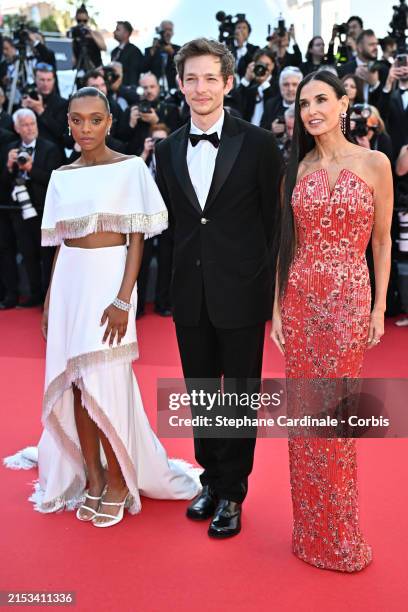 Sophie Wilde, Mike Faist and Demi Moore attend the "Kinds Of Kindness" Red Carpet at the 77th annual Cannes Film Festival at Palais des Festivals on...