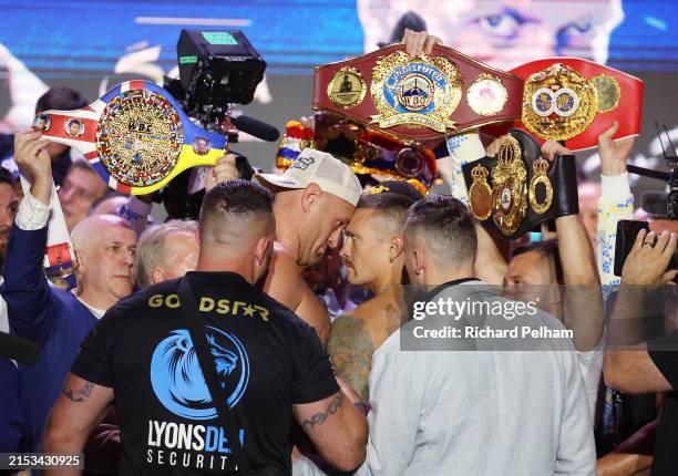 Tyson Fury and Oleksandr Usyk face off after weighing in ahead of the IBF, WBA, WBC and WBO heavyweight titles' fight between Tyson Fury and...