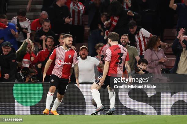 Adam Armstrong of Southampton celebrates scoring his team's second goal with teammate Ryan Manning during the Sky Bet Championship Play-Off...