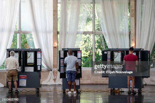 Voters cast ballots in Georgia's primary election at a polling location on May 21, 2024 in Atlanta, Georgia. Among the races on the ballot in Fulton...