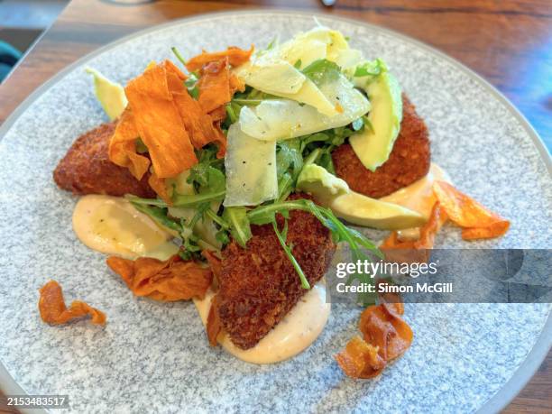 spiced sweet potato cakes with chipotle aioli, avocado, rocket/arugula and pecorino cheese shavings - potato cake australia stock pictures, royalty-free photos & images