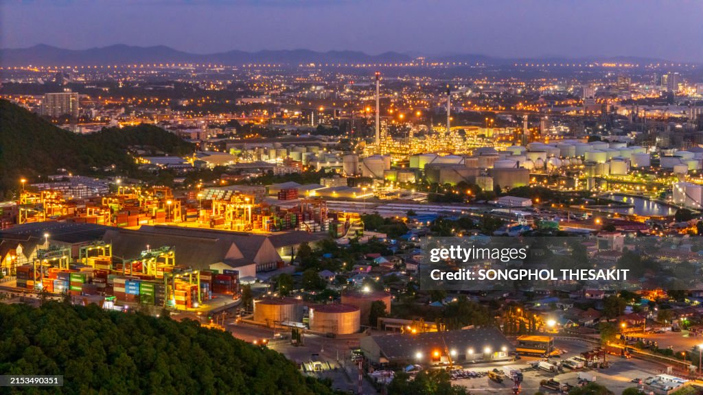 Aerial view/oil refinery and ships used to transport oil by sea.