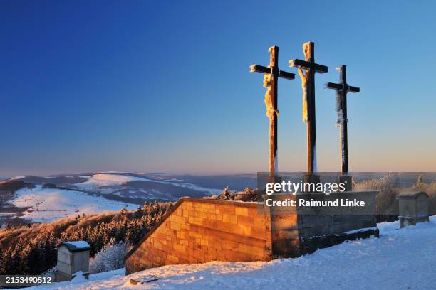 crosses on the top of kreuzberg, dusk, rhön mountain, bavaria, germany, europe - rhön stock-fotos und bilder