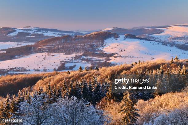view over winter landscape from kreuzberg to arnsberg mountain, rhön mountain, bavaria, germany, europe - rhön stock-fotos und bilder