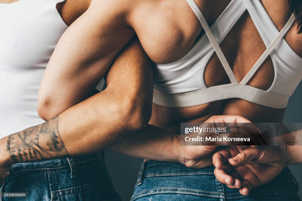 Strong and muscular women showing their biceps.