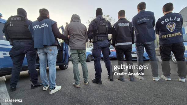 People are detained by police officers in operations organized in Italy, Switzerland, Germany and Turkiye in cooperation with the International...