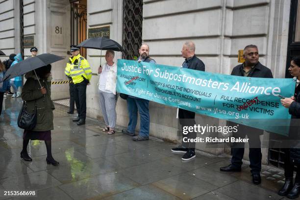 On the first day that former Chief Executive of Post Office Ltd, Paula Vennells, gives evidence to the Post Office inquiry, a banner is held by...