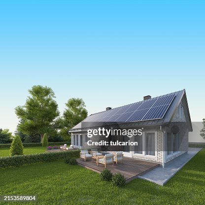Solar Panels on a Gray Metal Roof of Modern White Brick House Solar Panels on a Gray Metal Roof of Modern White Brick House