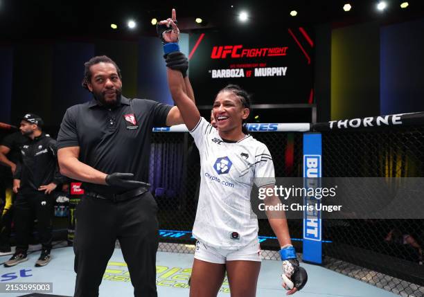 Angela Hill reacts after her submission victory against Luana Pinheiro of Brazil in a strawweight fight during the UFC Fight Night event at UFC APEX...