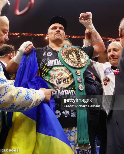 Oleksandr Usyk poses for a photo with the Undisputed Heavyweight title belt following victory over Tyson Fury in the IBF, WBA, WBC, WBO and...