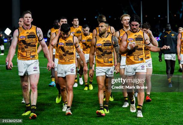Hawthorn players leave the ground after losing the round 10 AFL match between Yartapuulti and Hawthorn Hawks at Adelaide Oval, on May 19 in Adelaide,...