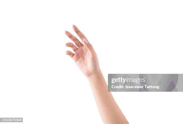 a hand is raised in the air, with the fingers spread out - palma de la mano fotografías e imágenes de stock
