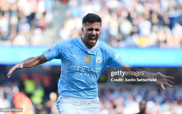Rodri of Manchester City celebrates scoring his team's third goal during the Premier League match between Manchester City and West Ham United at...