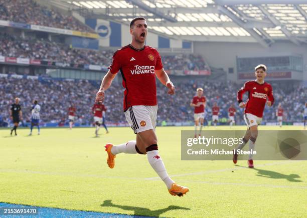 Diogo Dalot of Manchester United celebrates scoring his team's first goal during the Premier League match between Brighton & Hove Albion and...