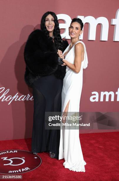 Demi Moore and Cher attend the amfAR Cannes Gala 30th edition Presented by Chopard and Red Sea International Film Festival at Hotel du Cap-Eden-Roc...