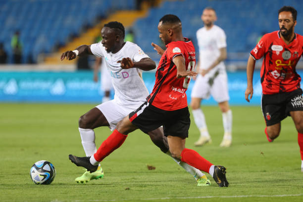 Nassr's Senegalese Forward Sadio Mane is marked by Riyadh's Saudi midfielder Fahad al-Rashidi during the Saudi Pro League football match between...