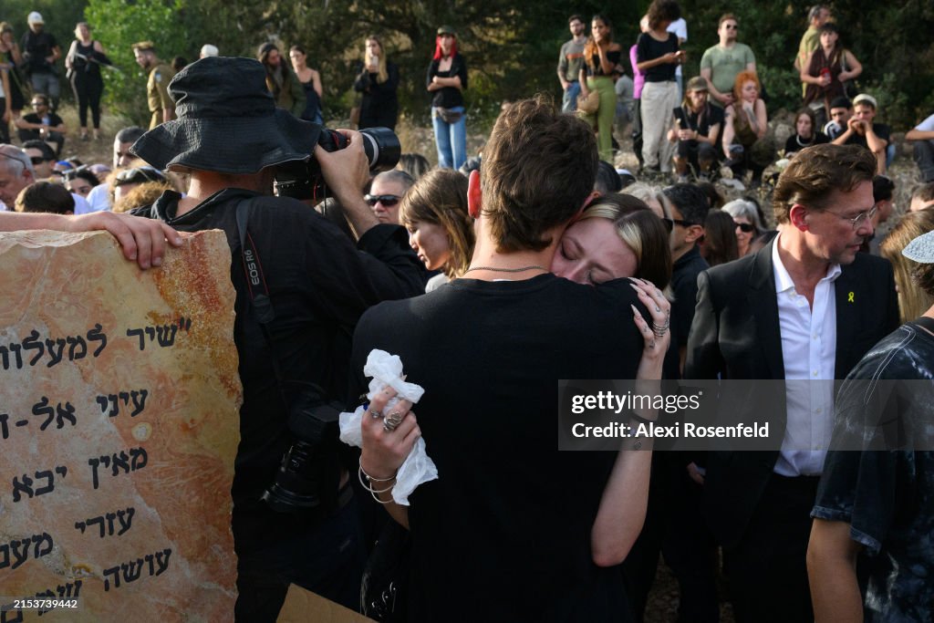 Shani Lock Mourners embrace at a funeral service for Shani Louk on May 19, 2024 ...