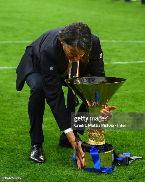 Head Coach Simone Inzaghi of FC Internazionale celebrates with the trophy during the Serie A TIM match between FC Internazionale and SS Lazio at...