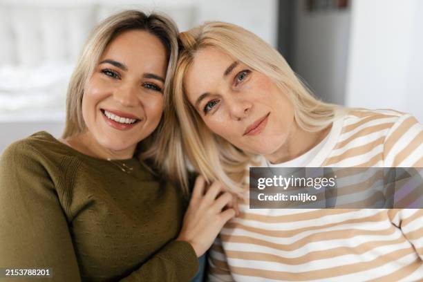 sisters having relaxing time at home - sister stock pictures, royalty-free photos & images