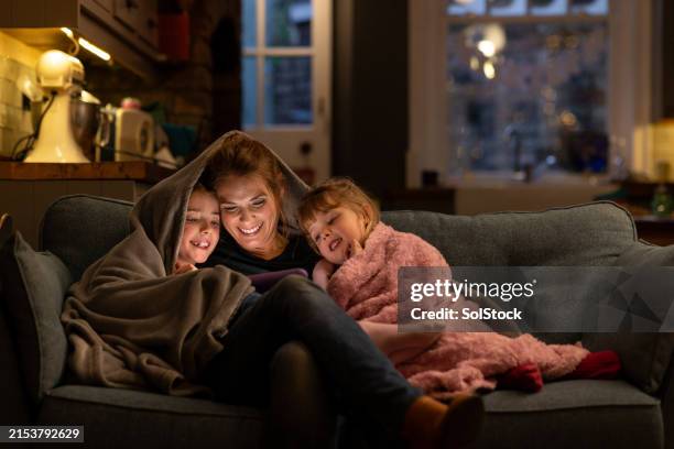 cosy evenings on the sofa - winter bildbanksfoton och bilder