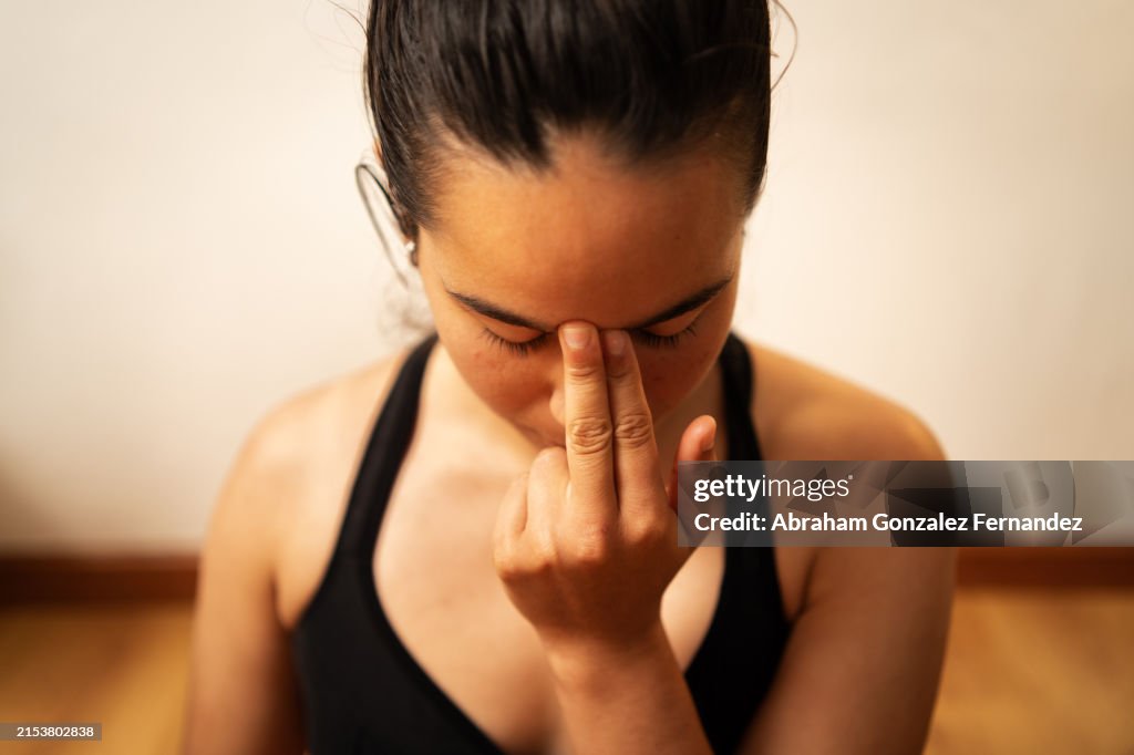 Woman practicing breathing exercises yoga