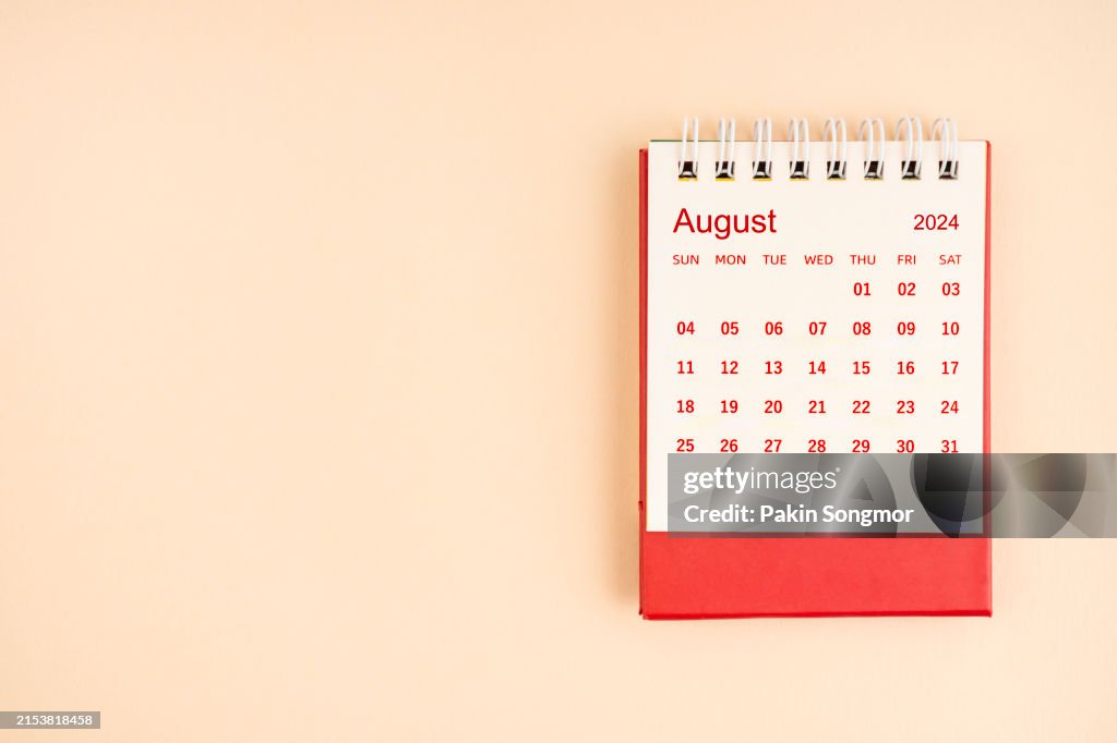 August 2024 Desk Calendar on yellow color background, Position with copy space.