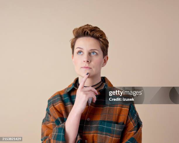 headshot of thoughtful young woman - all people stock pictures, royalty-free photos & images