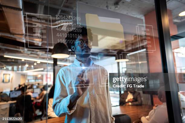 young businessman using augmented reality device at office - data science stock pictures, royalty-free photos & images