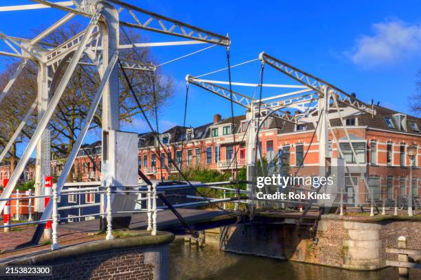 drawbridge and house boat ( woonboot ) in river leidsche rijn ( rhine ) in utrecht - rhine river stock pictures, royalty-free photos & images