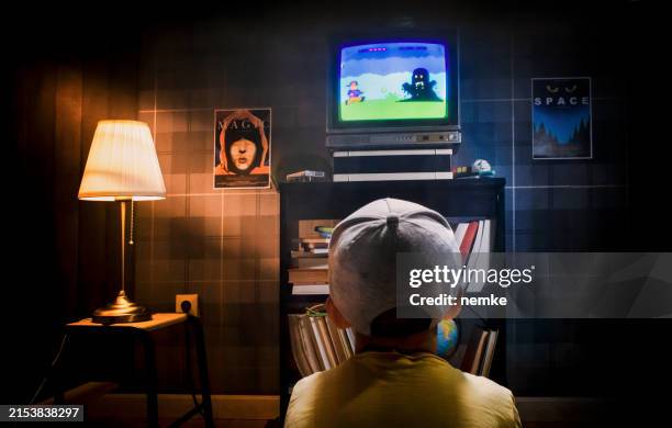 kid playing video games - 90s kids tv stock pictures, royalty-free photos & images