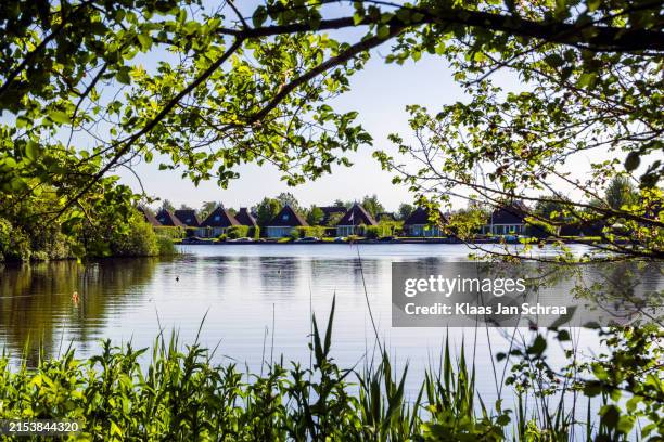 luchtfoto van het dorp eernewoude met bungalows bij ht park it wiid, friesland, the netherlands - bungalow stock pictures, royalty-free photos & images